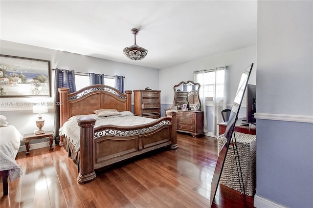 bedroom featuring dark hardwood / wood-style flooring