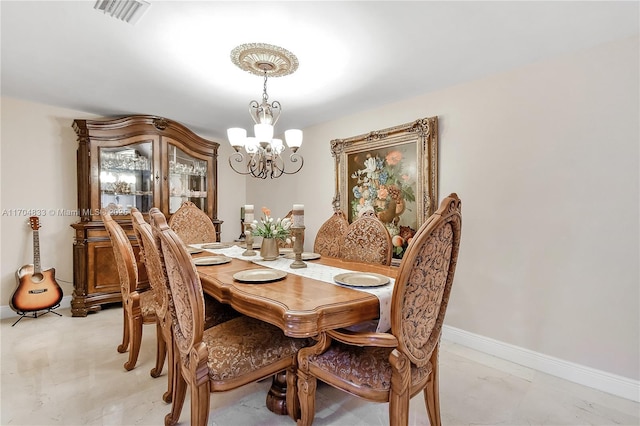 dining room with a chandelier