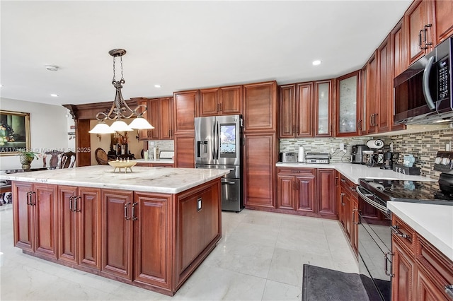 kitchen with a center island, stainless steel fridge with ice dispenser, electric range, pendant lighting, and backsplash