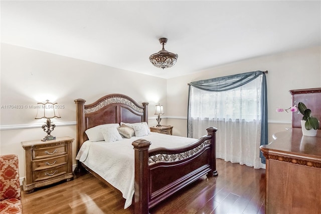 bedroom featuring dark hardwood / wood-style floors