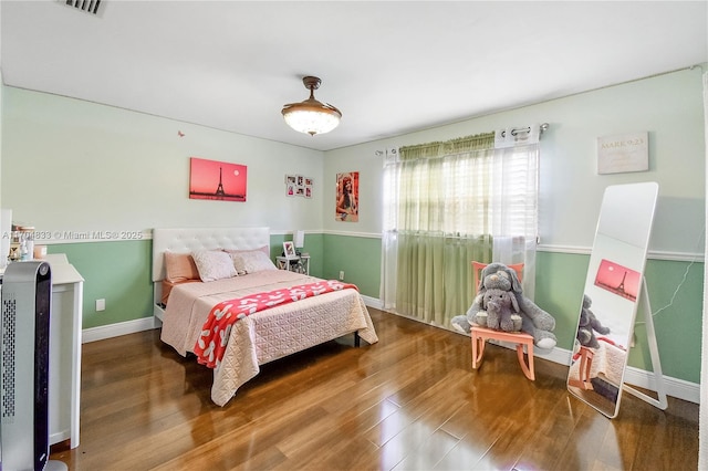 bedroom with wood-type flooring