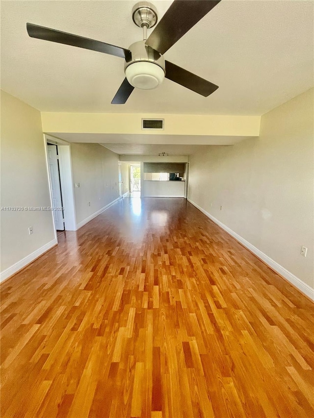 unfurnished room featuring ceiling fan and light wood-type flooring