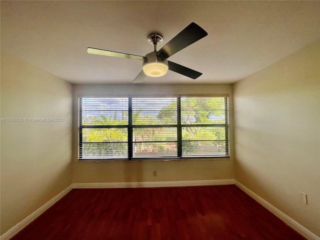 spare room featuring hardwood / wood-style floors and ceiling fan