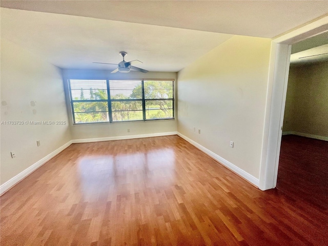 unfurnished room with wood-type flooring and ceiling fan