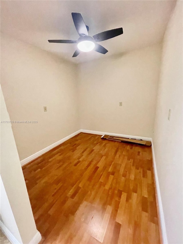 unfurnished room with wood-type flooring and ceiling fan