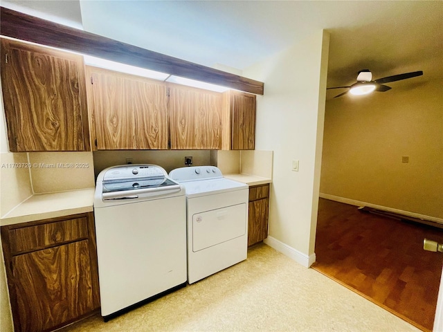 washroom with washer and clothes dryer, light hardwood / wood-style floors, cabinets, and ceiling fan