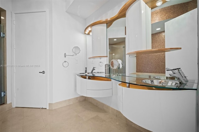 bathroom with tile patterned floors and sink