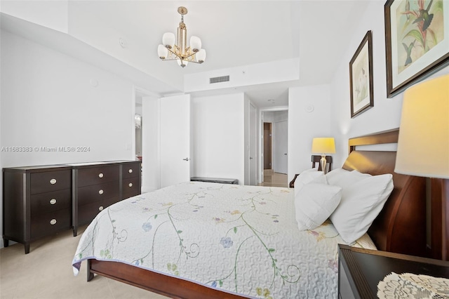 bedroom featuring an inviting chandelier