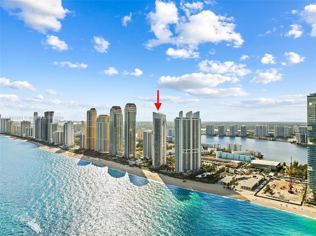 birds eye view of property featuring a water view and a view of the beach