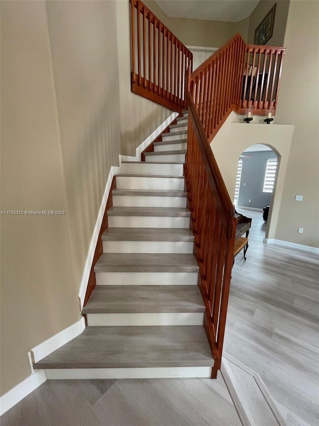 stairway featuring hardwood / wood-style flooring