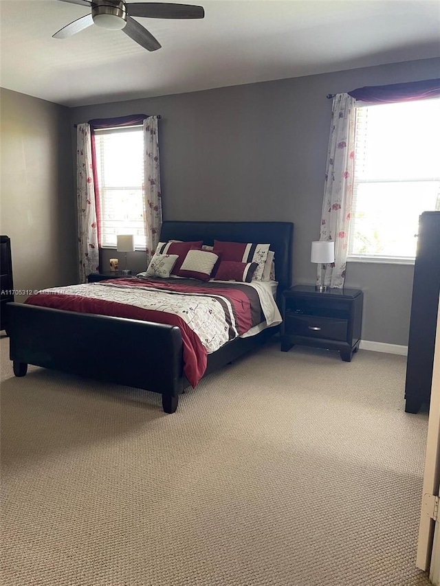 bedroom with ceiling fan and carpet