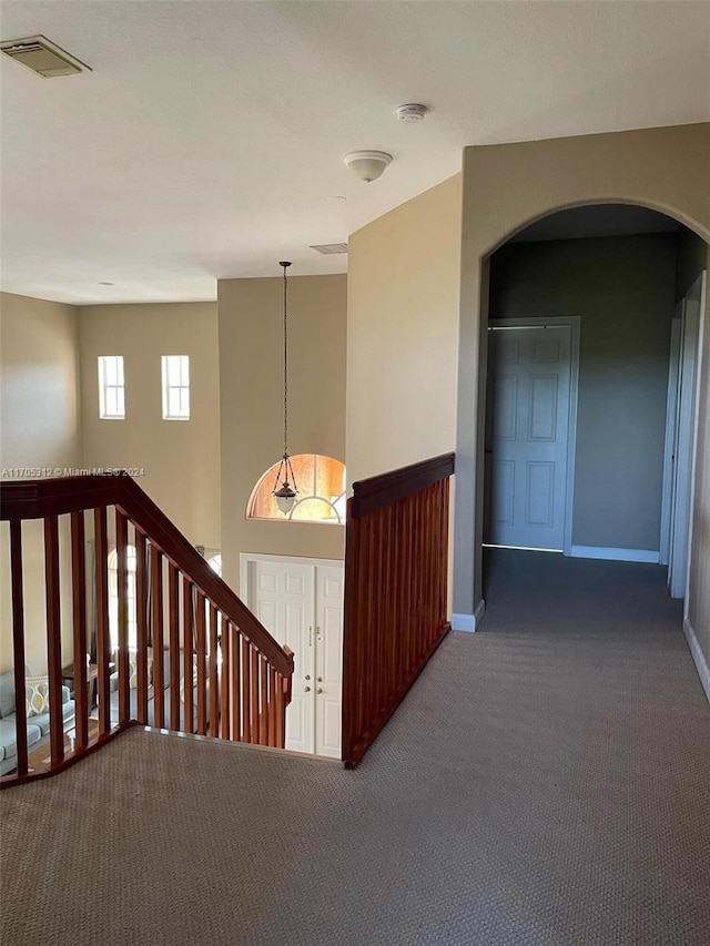 hallway with carpet flooring