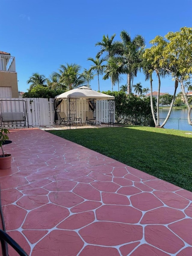 view of patio with a water view