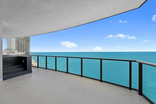 balcony featuring a water view