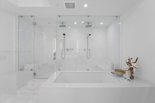 bathroom featuring plus walk in shower