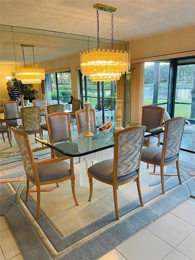 dining space featuring a notable chandelier, a textured ceiling, and a wealth of natural light