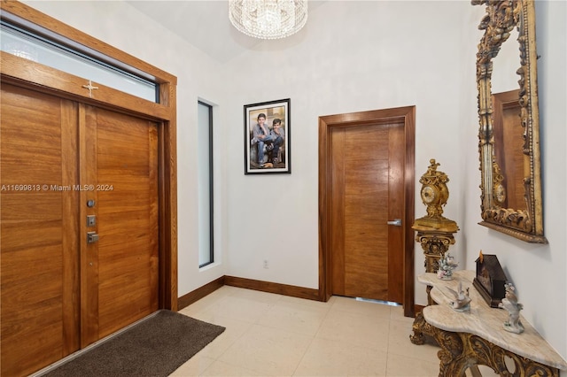 foyer entrance featuring a chandelier