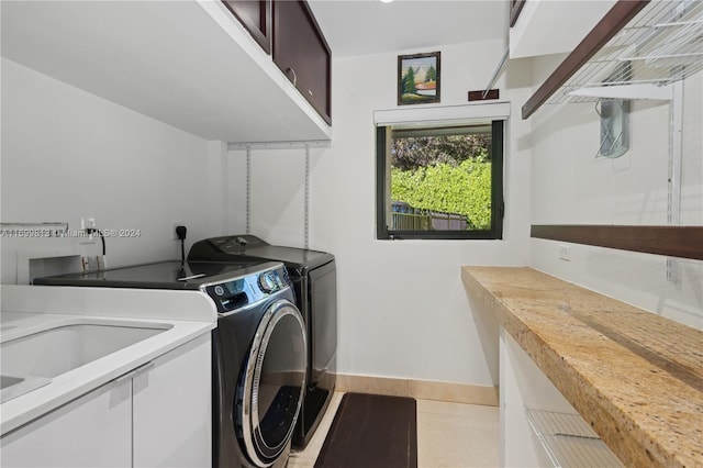 7001 Robles St, Coral Gables, FL 33143 - washroom with washing machine and dryer and cabinet space