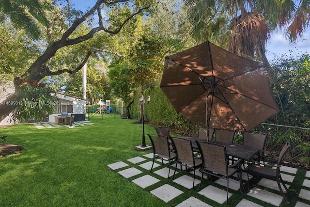 7001 Robles St, Coral Gables, FL 33143 - view of yard with a playground and a patio area