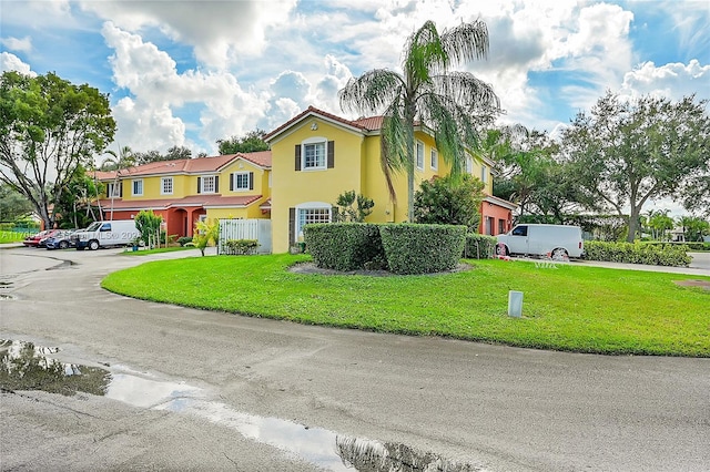 2011 SW 103rd Ter, Miramar, FL 33025 - view of front facade featuring stucco siding, a front yard, and a tile roof