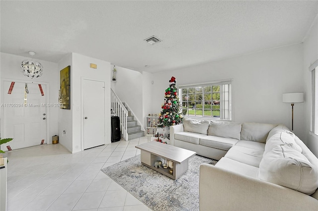 tiled living room with a textured ceiling