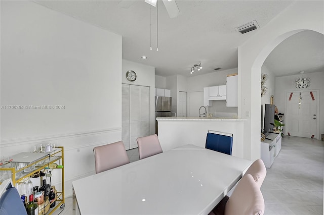 2011 SW 103rd Ter, Miramar, FL 33025 - dining space with arched walkways, a ceiling fan, and light tile patterned flooring