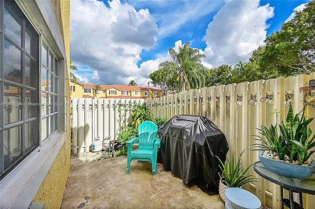 2011 SW 103rd Ter, Miramar, FL 33025 - fenced backyard featuring a patio, a grill, and a residential view