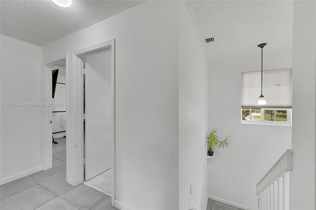 2011 SW 103rd Ter, Miramar, FL 33025 - hall featuring a textured ceiling and baseboards