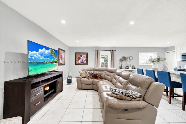 living room with light tile patterned floors