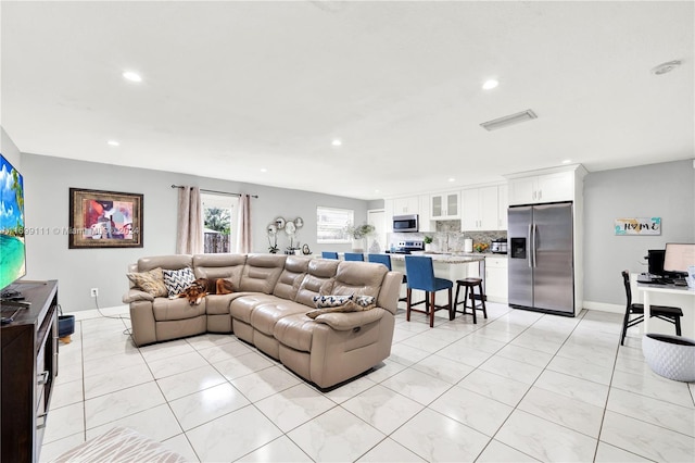 living room featuring light tile patterned floors