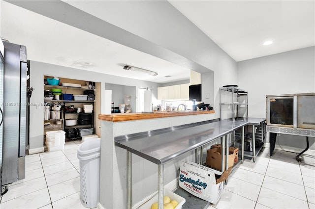 kitchen with light tile patterned floors