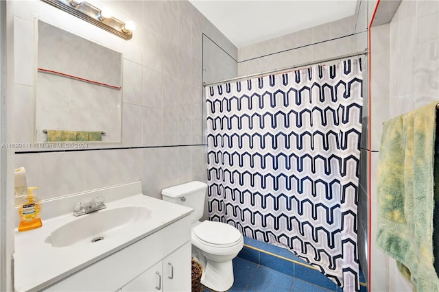 full bathroom with vanity, toilet, tile walls, and shower / bath combo with shower curtain