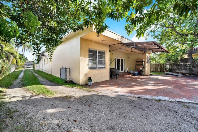 rear view of property with a carport