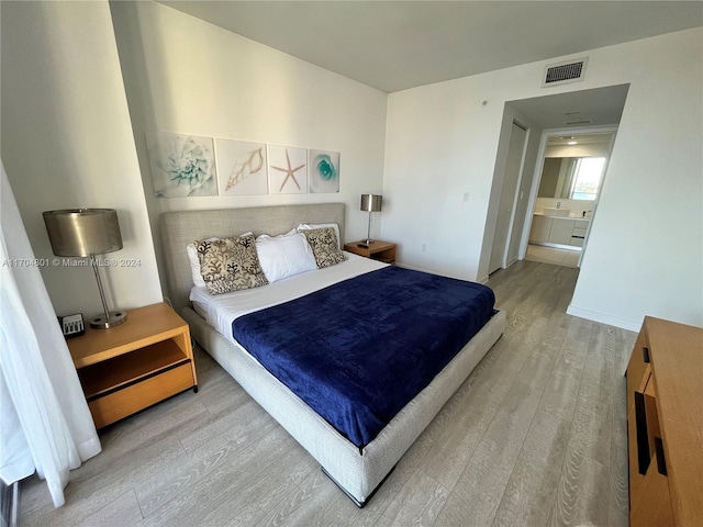 bedroom with light hardwood / wood-style floors