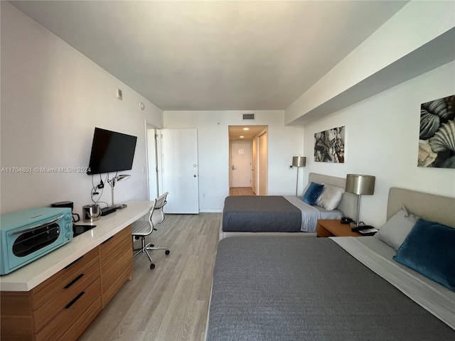 bedroom featuring light wood-type flooring