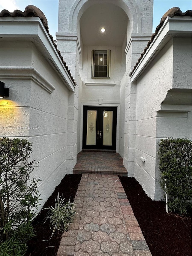 entrance to property featuring french doors