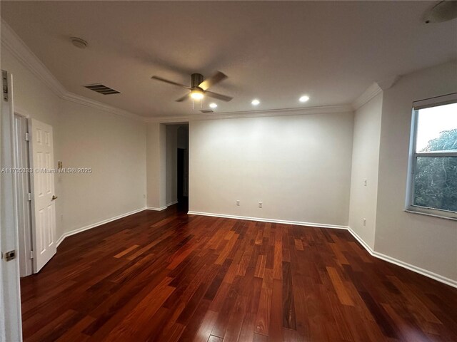 empty room with ceiling fan, crown molding, and dark wood-type flooring