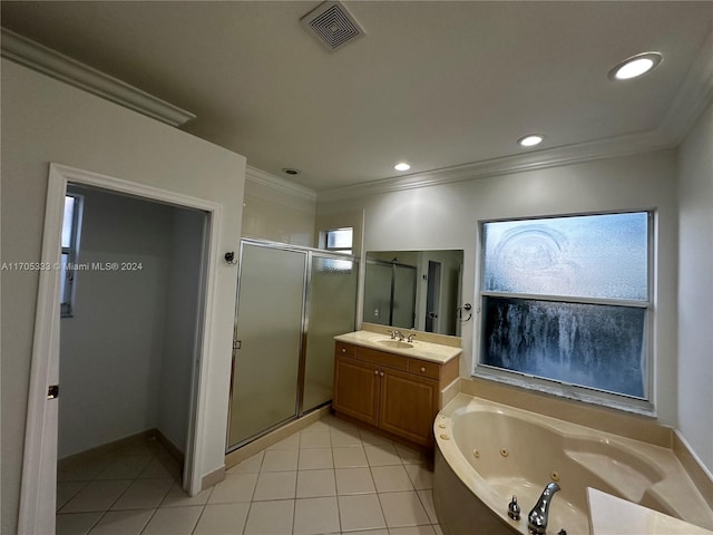 bathroom with tile patterned flooring, vanity, ornamental molding, and independent shower and bath