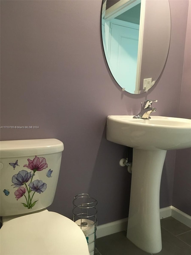 bathroom with tile patterned floors and toilet