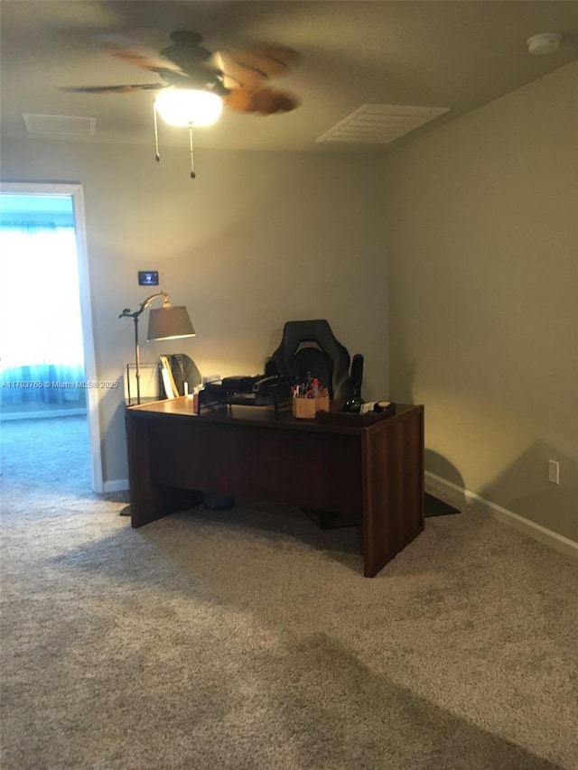 carpeted home office featuring ceiling fan and baseboards