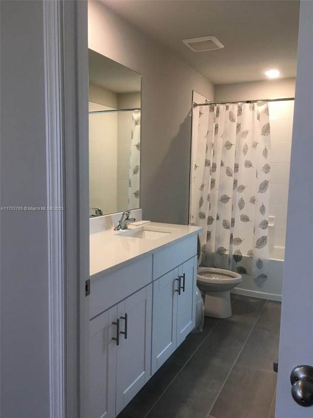 full bathroom with toilet, shower / bath combo with shower curtain, and vanity