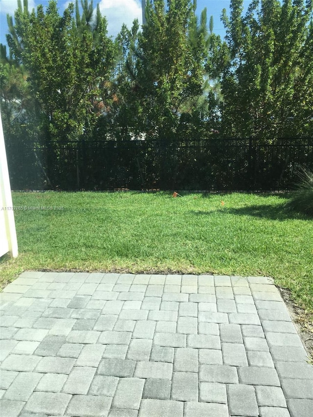 view of patio featuring fence