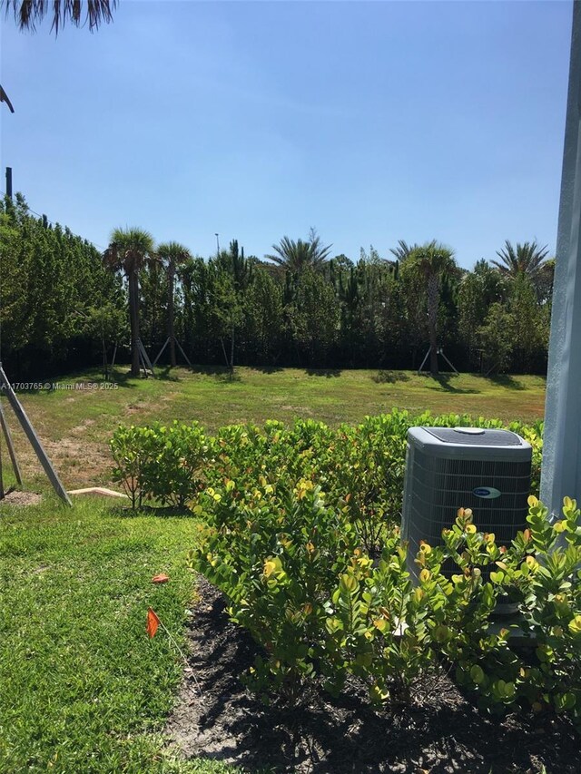 view of yard featuring central AC unit