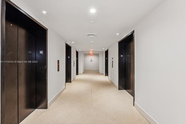 hallway featuring elevator