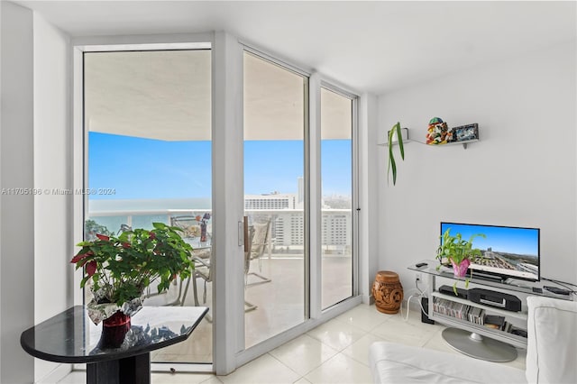 doorway to outside featuring light tile patterned flooring