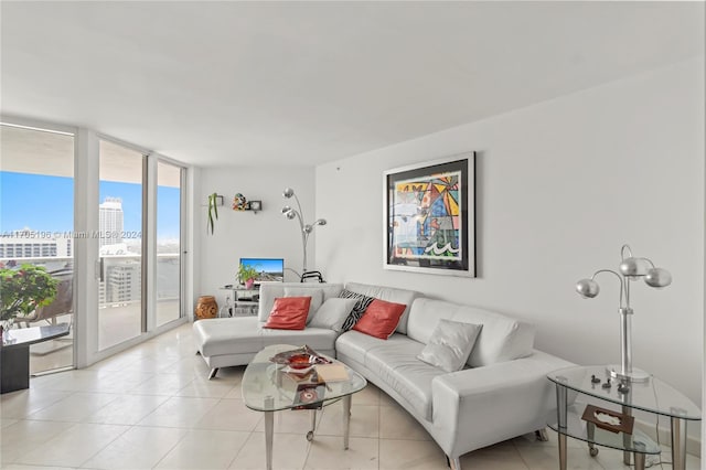 tiled living room with a wall of windows