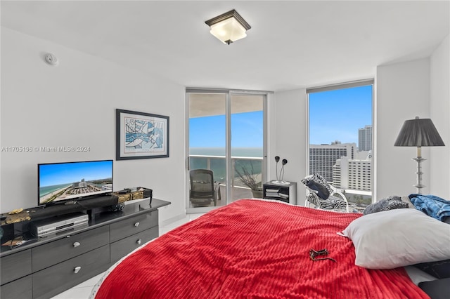 bedroom featuring floor to ceiling windows and access to exterior