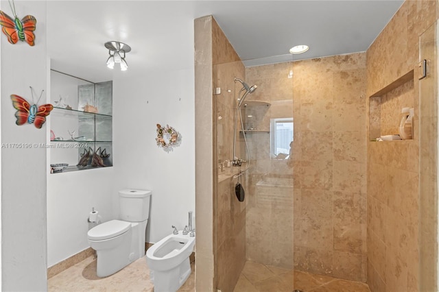 bathroom with a tile shower, tile patterned floors, a bidet, and toilet