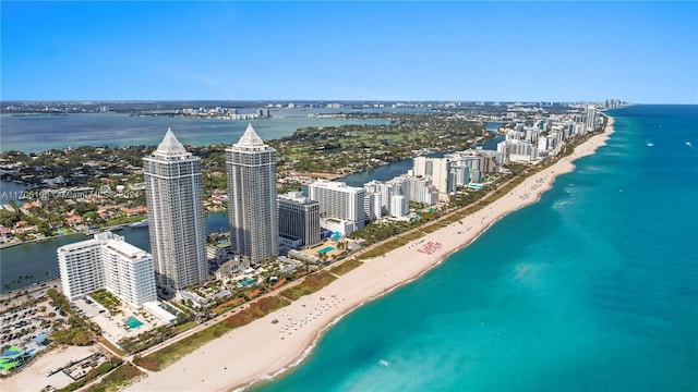 birds eye view of property featuring a water view and a view of the beach