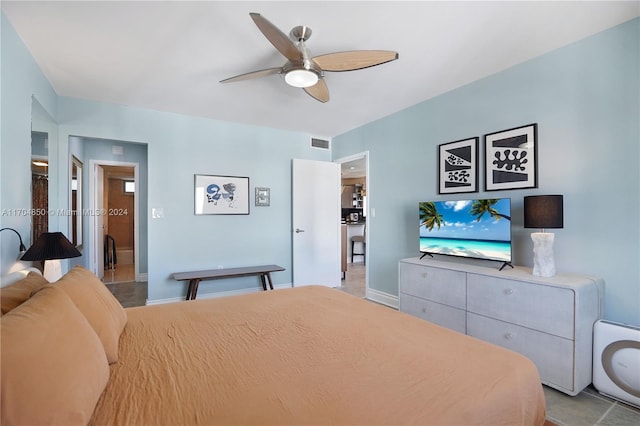 bedroom featuring ceiling fan and light tile patterned floors